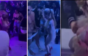 Uma loira gata e seu amigo se divertindo muito em um show dançante na balada